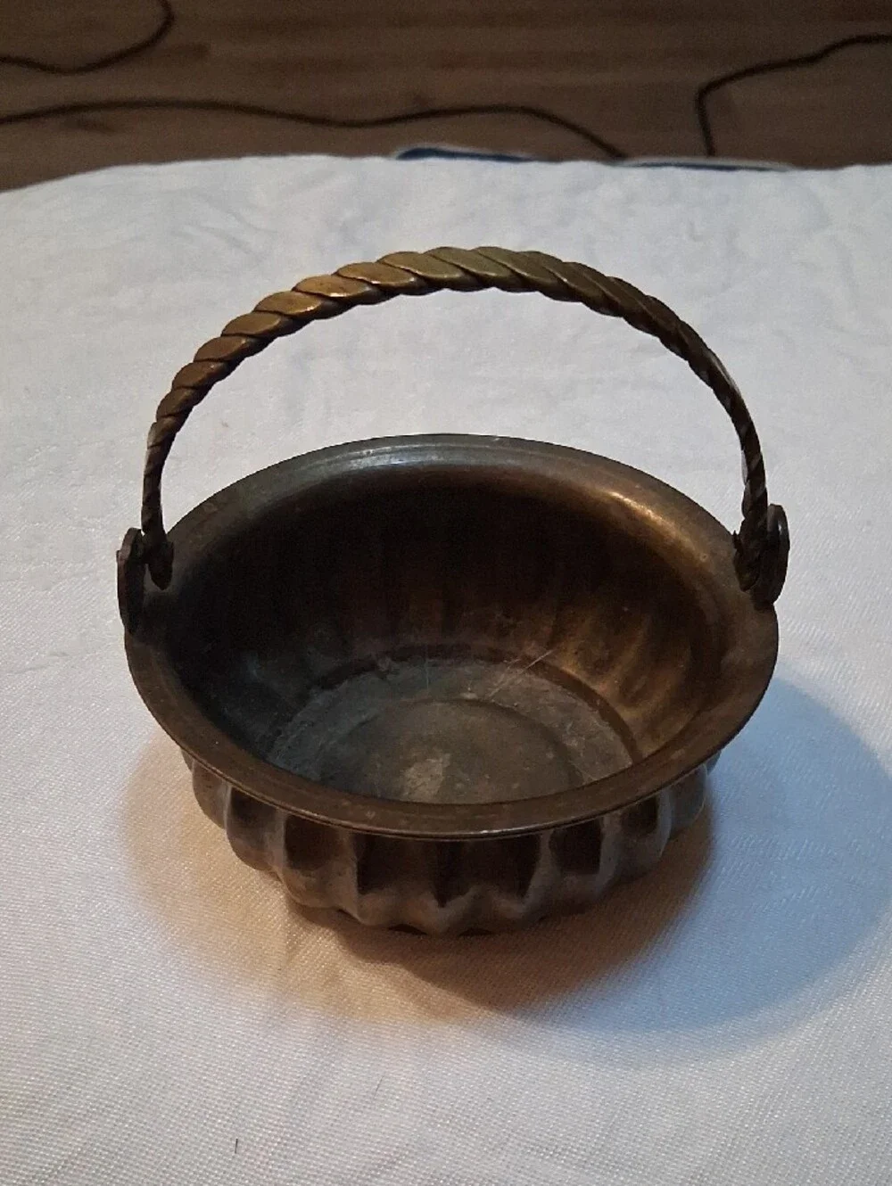 Vintage Brass-Tone Decorative Basket with Twisted Handle